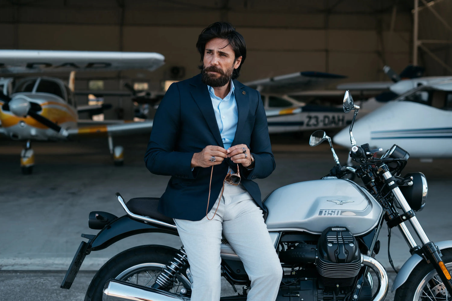Motorcyclist in a Brummell Blazer on a Motorcycle at a Private Aircraft Hangar