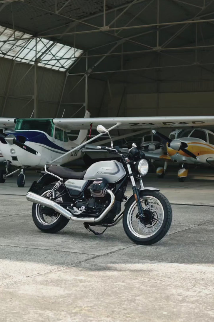 Motorcyclists wearing the Royal Navy Brummell Blazer, zipping it up and taking off on his motorcycle.